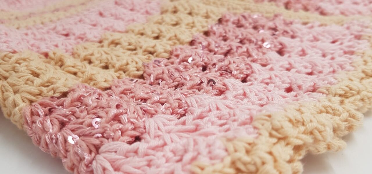 Soft pink and beige handmade crochet — a symbol of patience, creativity, and tranquility.