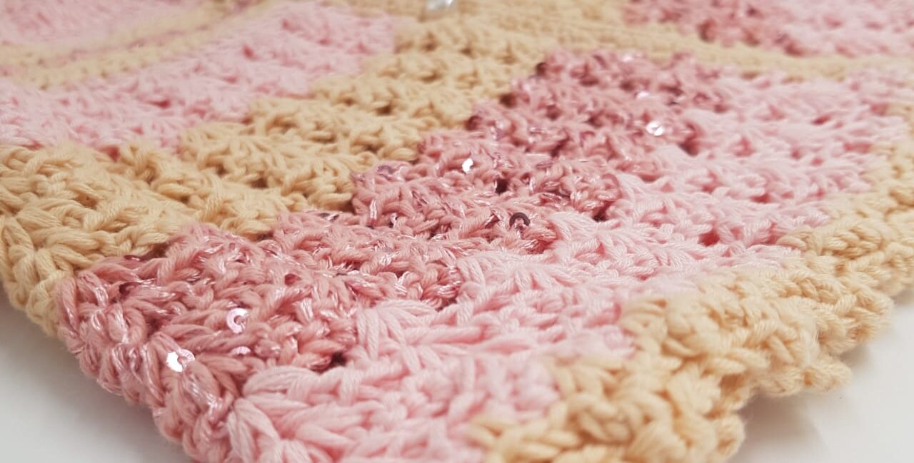 Soft pink and beige handmade crochet — a symbol of patience, creativity, and tranquility.