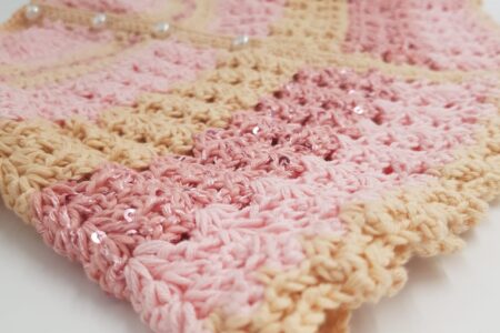Soft pink and beige handmade crochet — a symbol of patience, creativity, and tranquility.